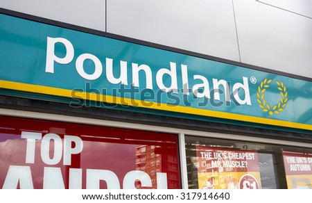 LEEDS, UK - 15 SEPTEMBER 2015.  Poundland.  Sign above the entrance to the Poundland store in Seacroft, Leeds.  Poundland is a leading discount retail chain in the UK.