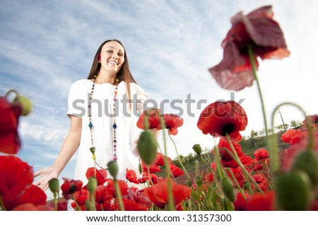 Funny woman in poppy field