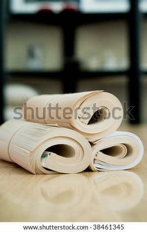 Rolled book with reflection on the wood table