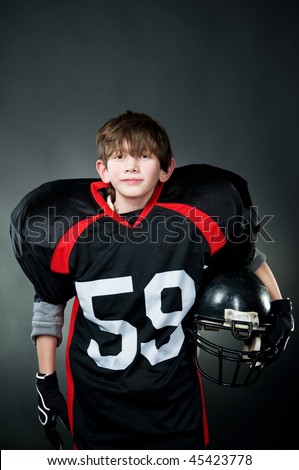 American football player isolated on black