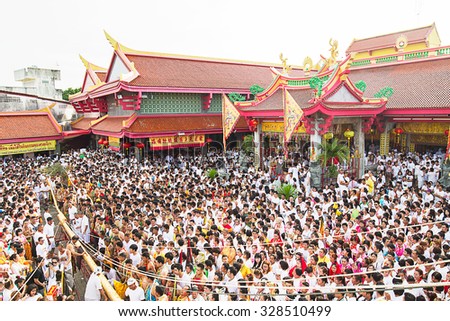 Many people joining ceremony to the sacred wood poles is the symbol of the beginning of Phuket Vegetarian Festival October 12, 2015 in Phuket, Thailand
