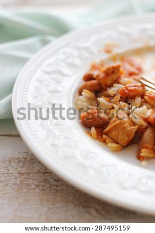 rice and beans with chicken  in tomato sauce