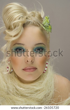 Portrait of young model with hair and makeup professionally done.