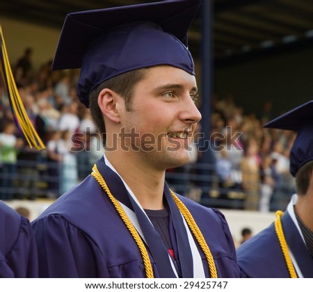 Highschool graduate dressed in full cap and gown