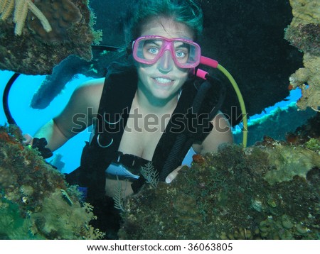scuba diver female on ship wreck site