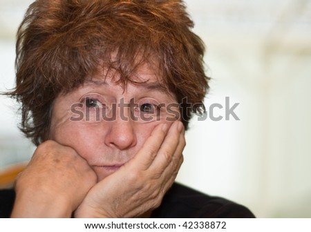 Caucasian woman worried and contemplating posed in front of white background