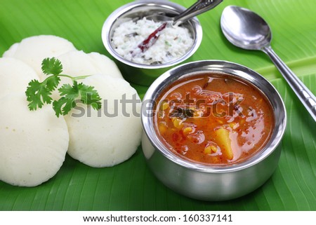 idli, sambar and coconut chutney, south indian breakfast on banana leaf