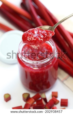 homemade rhubarb jam in jar isolated on white background