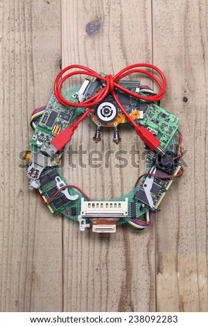geeky christmas wreath made by old computer parts hanging on wooden door, computer parts recycling idea, christmas card design