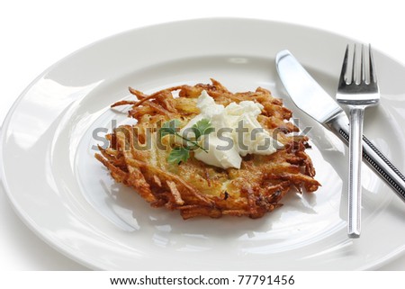 potato pancake with sour cream