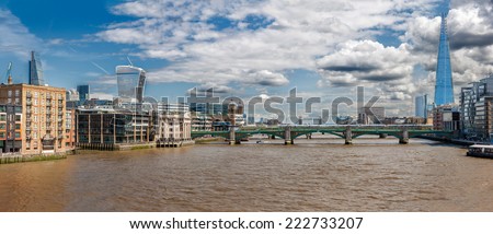 LONDON -AUGUST 13: The  River Thames  on August 13, 2014  in London. The River Thames is the longest river entirely in England and the second longest in the United Kingdom, after the River Severn.