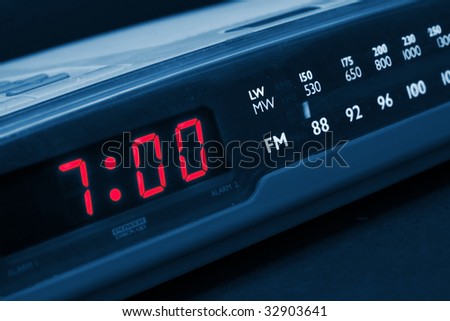 Alarm radio clock indicating time to wake up