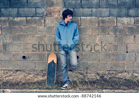 Young handsome boy in urban background