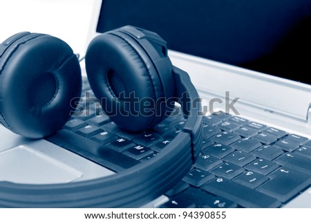 Headphones on Laptop, blue toned