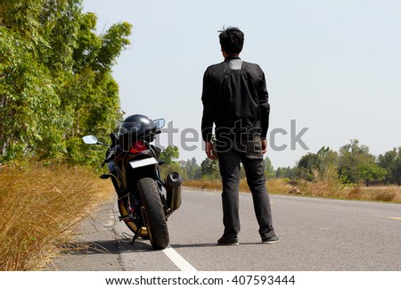 Men and motorcycle on road. Motorbike tourist concept