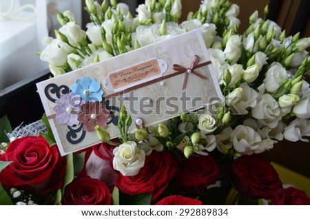 Bouquet of flowers with birthday greeting card\
Translation from russian: happy Birthday!