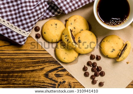 Chocolate Cookie with Coffee Background / Chocolate Cookie with Coffee / Chocolate Cookie with Coffee on Wooden Background