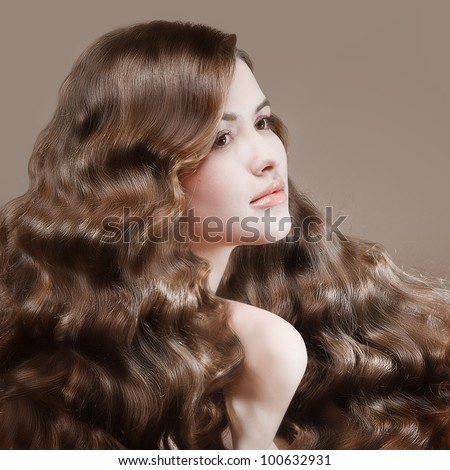 Beautiful young girl with long waved hair