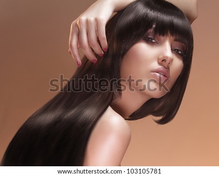 portrait of female face with long beauty glossy dark hair