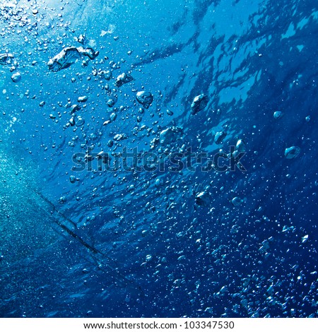 abstract blue underwater surface with air bubbles ripples