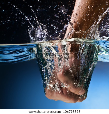 Men's Fist Punching Water Splash Stock Photo 106798598 : Shutterstock