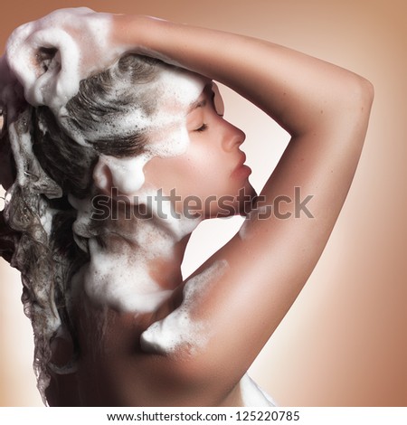 young beautiful caucasian girl soaping her head young beautiful caucasian girl soaping her head