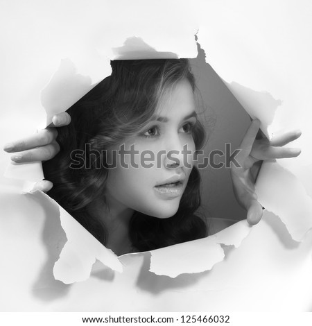 young girl tearing white paper wall breakthrough design element template