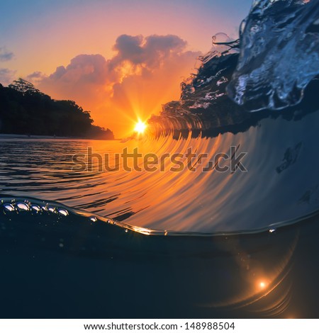 Perfect Ocean Breaking Closing Surfing Wave At Sunset Time And Botom Underwater Part As Design Template With Sunbeams