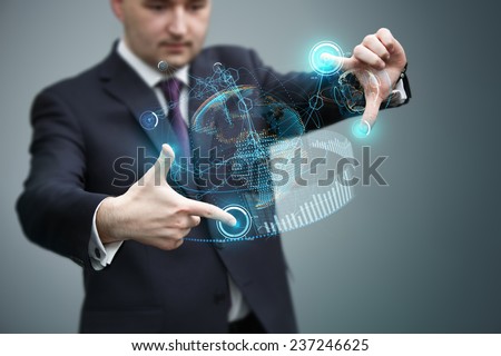 Businessman working with virtual holographic earth interface. Future technology as design concept.