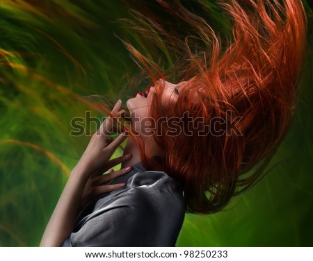 red streaming hair expressive emotional girl on green abstract background