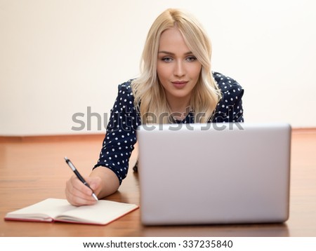 Computer. Laptop.Woman.Girl. Businesswoman.Girl working at the laptop. Studio.White background.Space.Smiling. Education center. Business seminar.