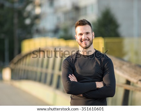 Portrait Of Male Runner On Urban Street
