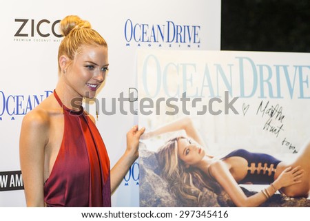 MIAMI BEACH, FL - JULY 16, 2015: Martha Hunt sings the Cover of the Magazine Ocean Drive during Miami Swim Week at the Delano Hotel on July 16th, 2015