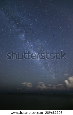 The milky way galaxy over open ocean as seen from the shore line of Oahu, Hawaii\'s south shore.