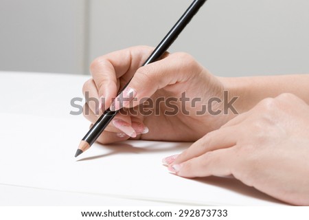 Pencil, paper, hand