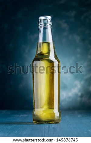 alcoholic beverage bottle on blue background