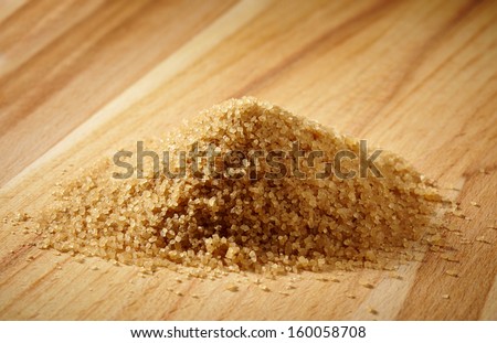 brown sugar heap on wooden table