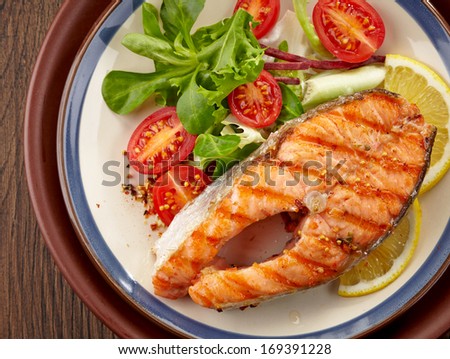 fresh grilled salmon steak slice on a plate