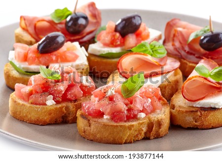 Spanish food tapas. Toasted bread with tomato and ham
