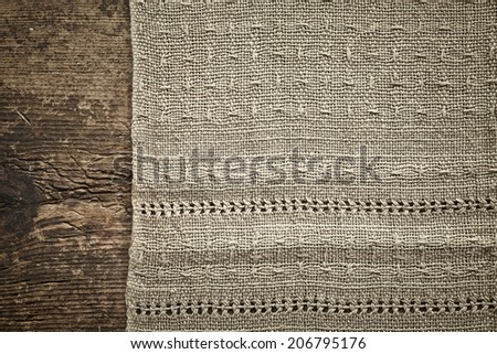 old gray linen napkin on wooden table