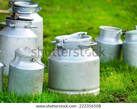 cow\'s milk in various metallic cans