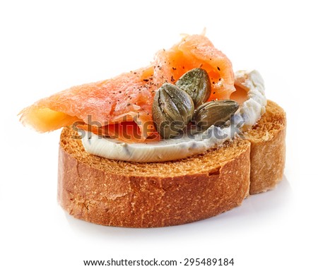 toasted bread with cream cheese and smoked salmon isolated on white background