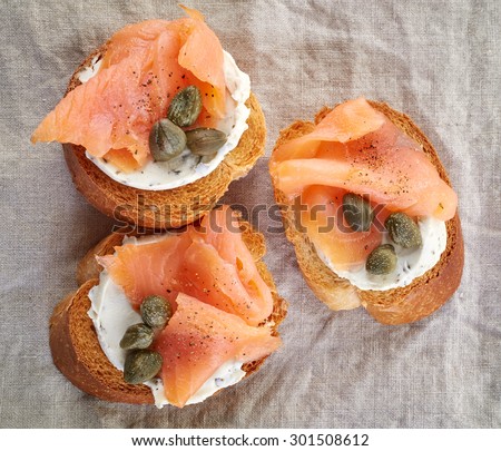 toasted bread slices with smoked salmon fillet and cream cheese