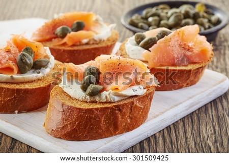 toasted bread slices with smoked salmon fillet and cream cheese