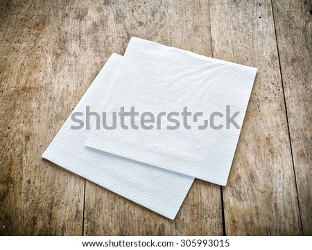 white paper napkins on old wooden table