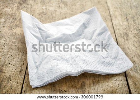 white paper napkin on old wooden table