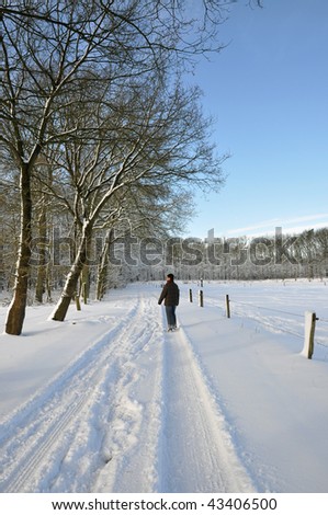 Senior female walking in a winter wonder land