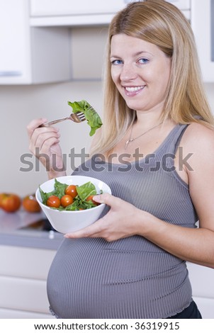 pregnant lady eating. pregnant woman eating