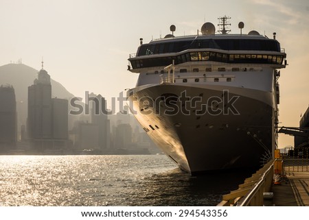 HONG KONG, CHINA - DECEMBER 22, 2014: Cruise ship at Kowloon pier. Hong Kong is popular travel destination with over 40 millions visitors per year.