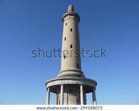 DALIAN, CHINA - SEPTEMBER 9, 2014: White Jade Hill Tower in blue sky. Construction finished in 1909 for Imperial Japanese Army showing loyalty to the emperor of Japan, located in Lushunkou, Dalian.